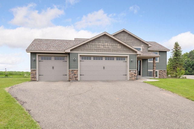 116 Wheat Field Ln, New Richmond, WI 54017 - craftsman-style home featuring stone siding, an attached garage, asphalt driveway, and a front yard