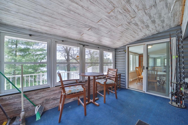 sunroom / solarium with wood ceiling, lofted ceiling, and carpet flooring