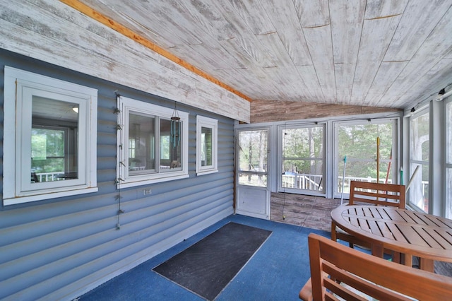 sunroom / solarium with vaulted ceiling