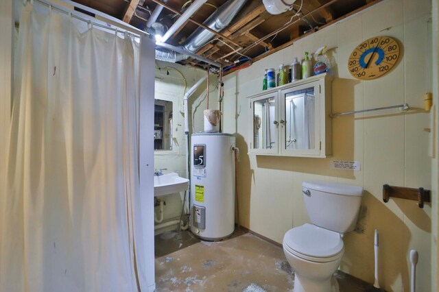 bathroom featuring electric water heater, concrete flooring, and toilet