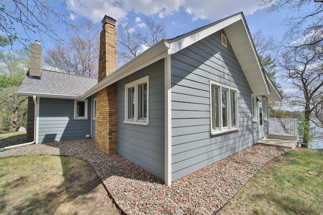 view of property exterior with a chimney