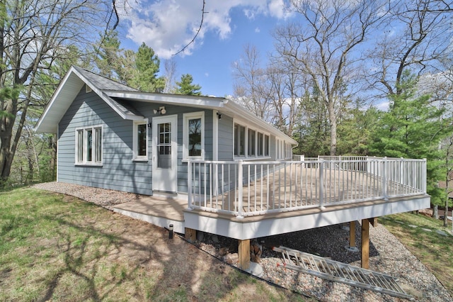 rear view of house with a wooden deck