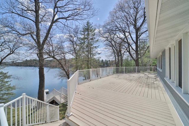 wooden terrace featuring a water view