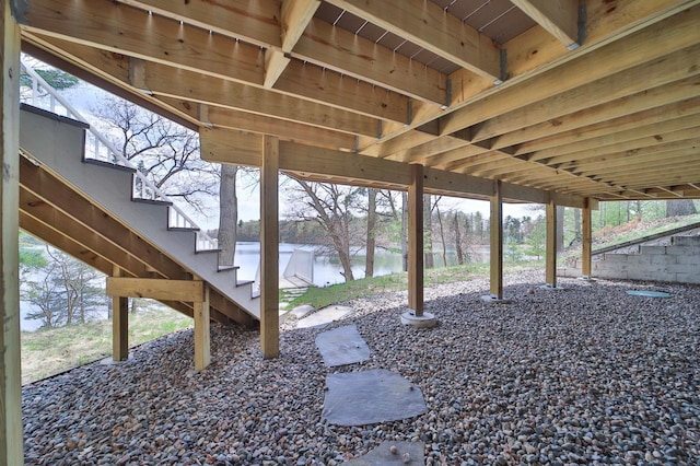 view of yard with stairway and a water view