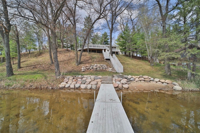 dock featuring stairs and a water view