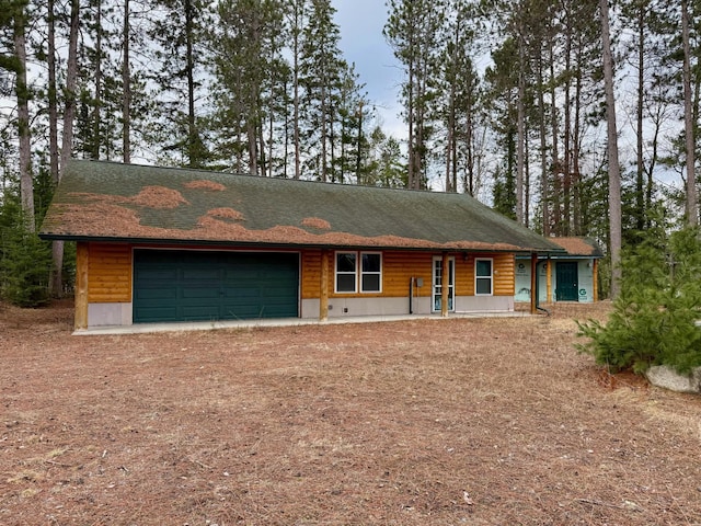 52325 County Road 31, Wirt, MN 56688 - view of front of house featuring driveway, roof with shingles, and a garage