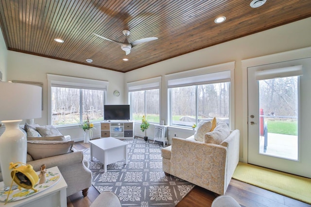 living area with a ceiling fan, recessed lighting, wooden ceiling, and ornamental molding