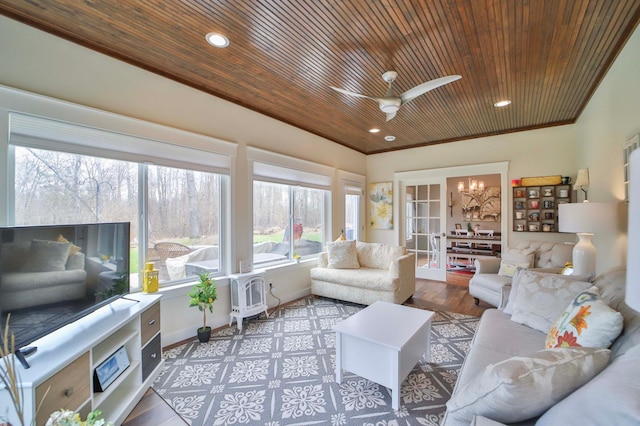 living room with a ceiling fan, baseboards, recessed lighting, and wood ceiling