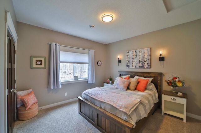 carpeted bedroom featuring baseboards