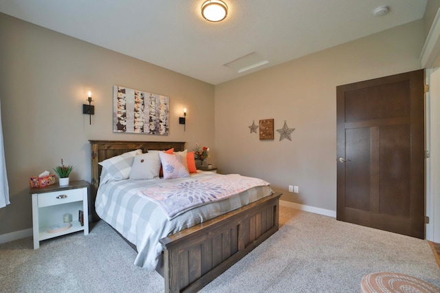 bedroom featuring carpet flooring and baseboards