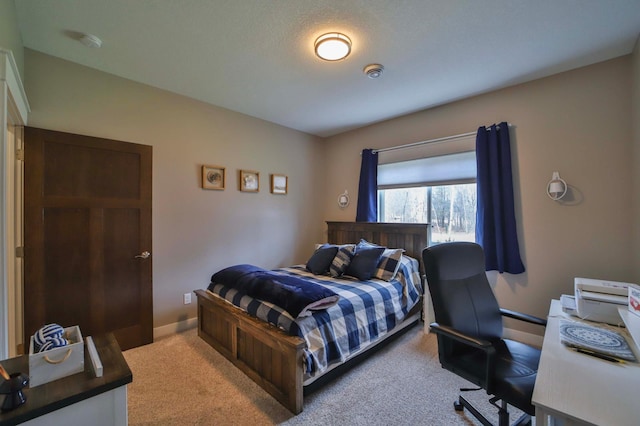 carpeted bedroom with baseboards