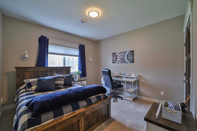 carpeted bedroom featuring baseboards