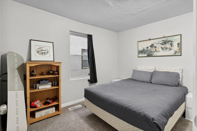 carpeted bedroom featuring visible vents, a textured ceiling, and baseboards