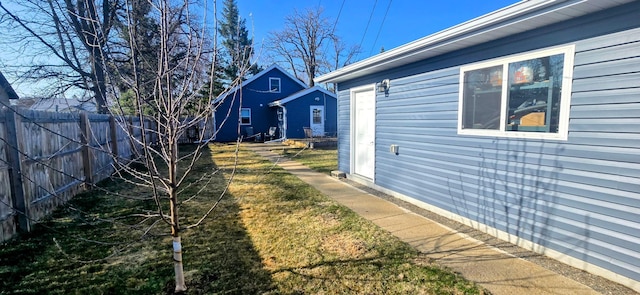 view of property exterior with fence
