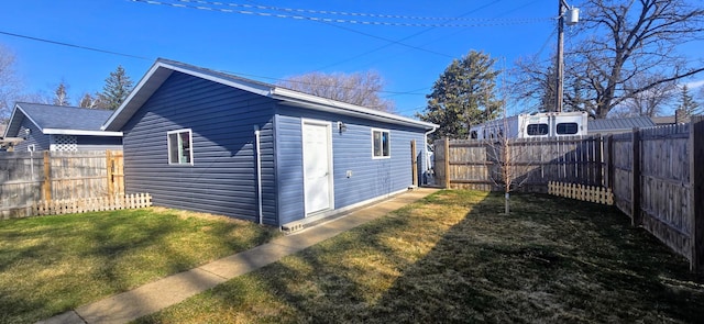 view of outbuilding featuring a fenced backyard and an outbuilding