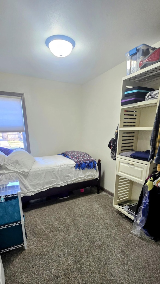 carpeted bedroom with baseboards