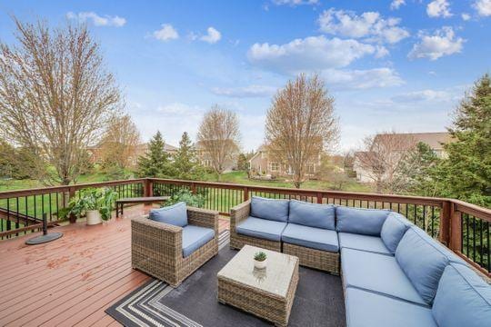 wooden terrace featuring outdoor lounge area