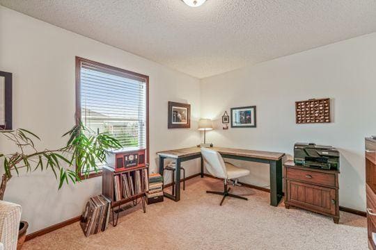 office area with light carpet and a textured ceiling