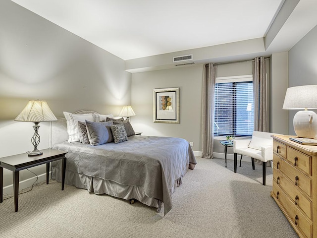 1235 Yale Pl Unit 101, Minneapolis, MN 55403 - bedroom with visible vents, light colored carpet, and baseboards
