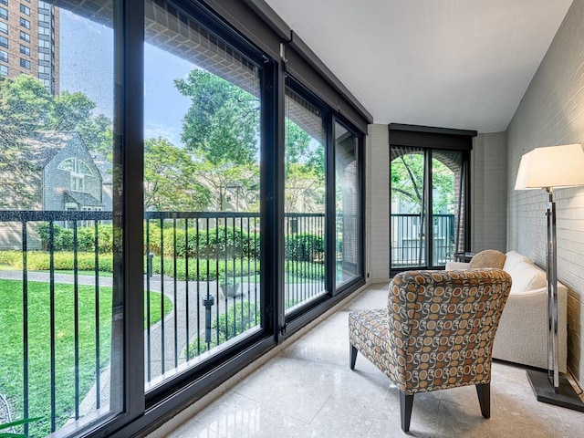 1235 Yale Pl Unit 101, Minneapolis, MN 55403 - sunroom with brick wall