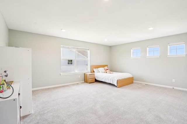 11504 Yuma Ln N, Dayton, MN 55369 - bedroom with multiple windows, baseboards, light colored carpet, and recessed lighting