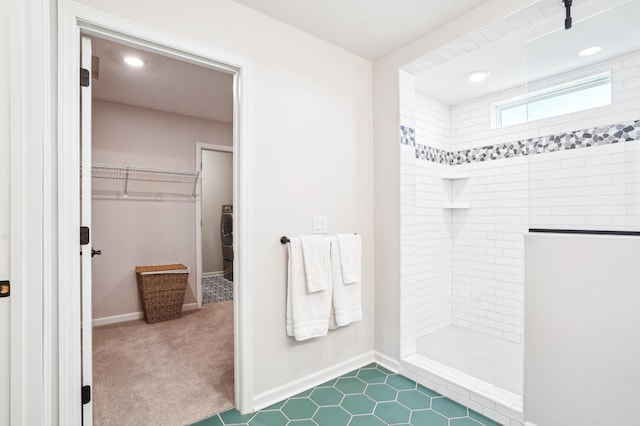 11504 Yuma Ln N, Dayton, MN 55369 - bathroom with a walk in shower, a walk in closet, baseboards, washer / clothes dryer, and recessed lighting
