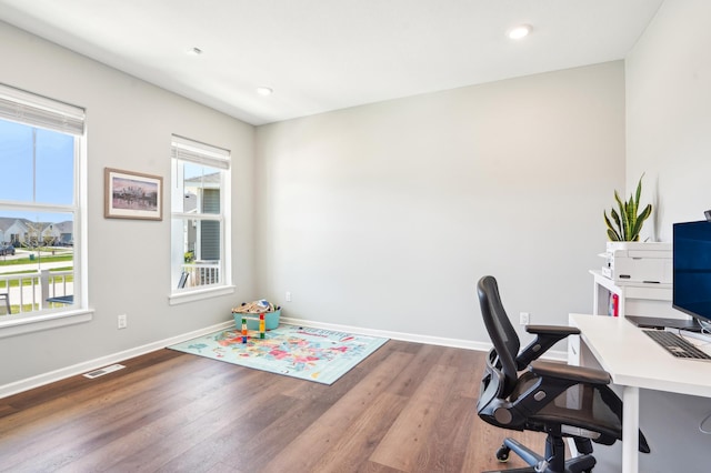 11504 Yuma Ln N, Dayton, MN 55369 - home office with plenty of natural light, wood finished floors, baseboards, and recessed lighting