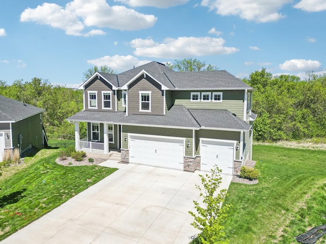 11504 Yuma Ln N, Dayton, MN 55369 - craftsman inspired home featuring covered porch, driveway, an attached garage, a front yard, and stone siding