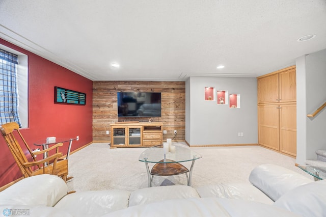 carpeted living area featuring baseboards, wood walls, an accent wall, and recessed lighting