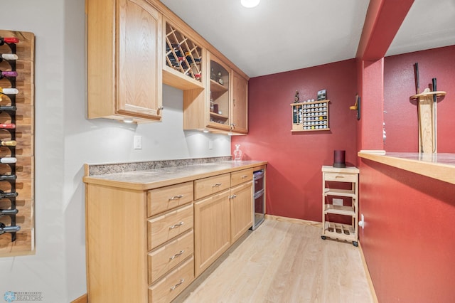 bar with baseboards and light wood finished floors