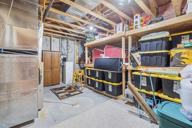 unfinished below grade area with heating unit and electric panel