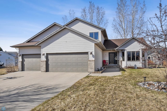 traditional home with a garage, driveway, a front lawn, and brick siding
