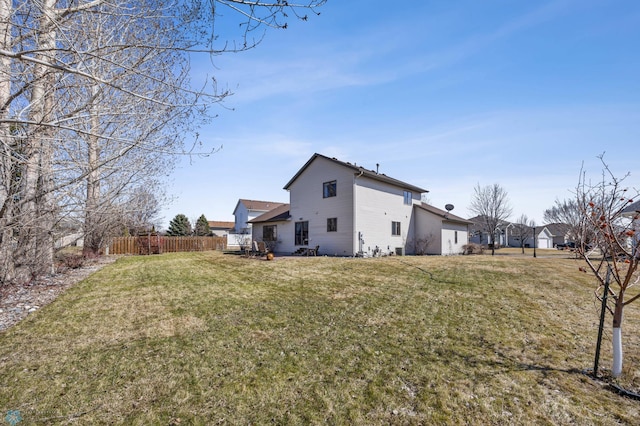 exterior space featuring a yard and fence