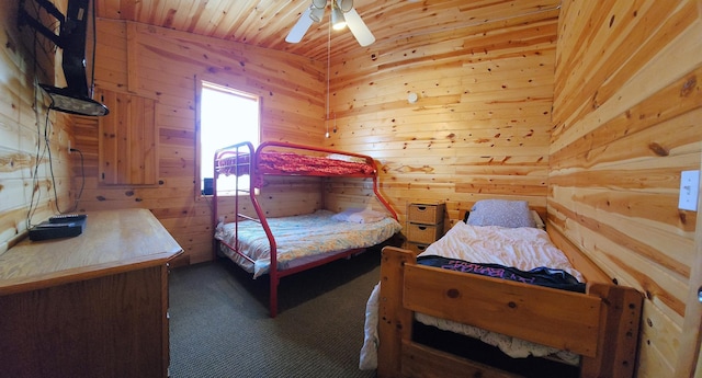 5227 Hyland Rd SW, Motley, MN 56466 - bedroom featuring wooden walls, wood ceiling, a ceiling fan, and carpet flooring