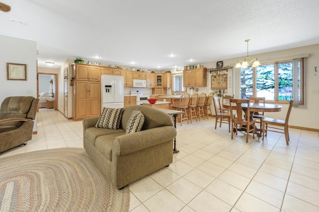 living area with baseboards, recessed lighting, a notable chandelier, and light tile patterned flooring