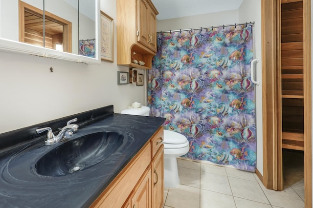 bathroom with tile patterned floors, a shower with shower curtain, toilet, and vanity