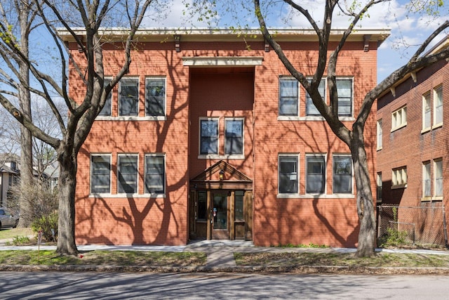 multi unit property with fence and brick siding