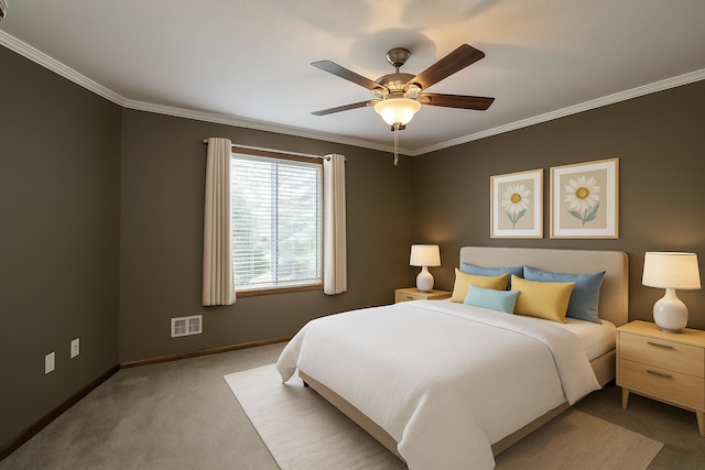 carpeted bedroom with ornamental molding, baseboards, and ceiling fan