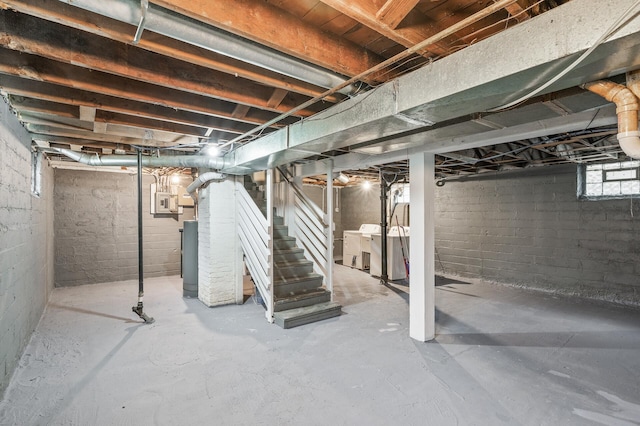 basement featuring stairs and washer / clothes dryer