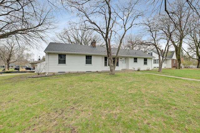 ranch-style home with a chimney and a front lawn