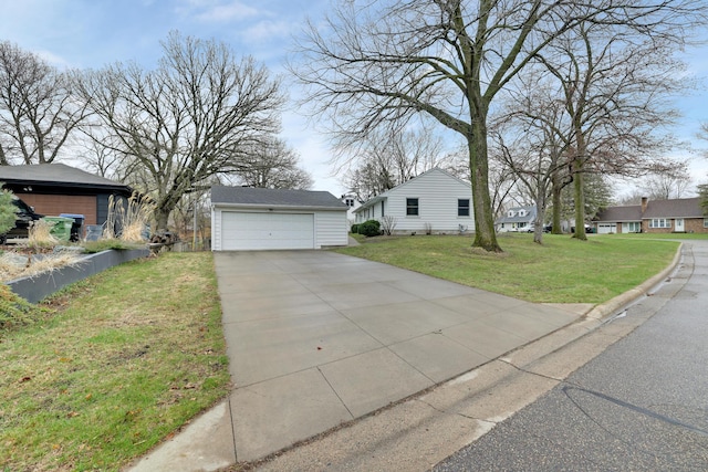 view of front of house with a residential view, a front yard, and a garage