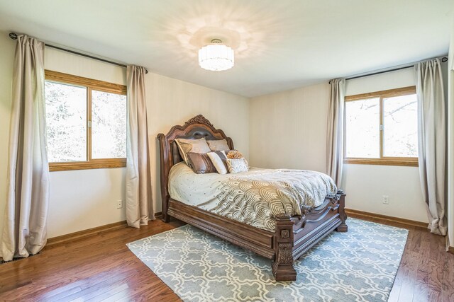 12720 Parkwood Dr, Burnsville, MN 55337 - bedroom featuring wood finished floors and baseboards