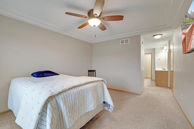 bedroom featuring a ceiling fan, baseboards, visible vents, and light carpet