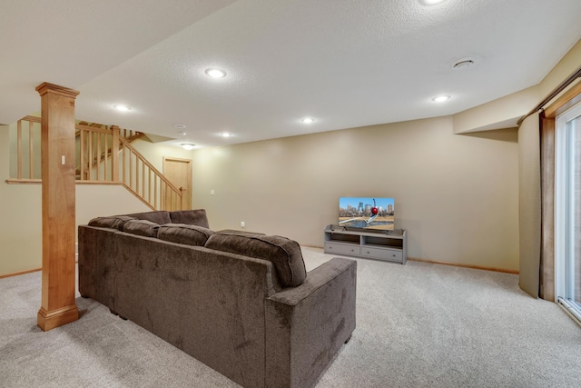 living room featuring carpet flooring, recessed lighting, and stairs