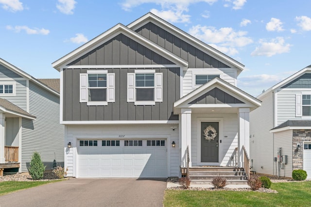 10257 Greenway Cir S, Cottage Grove, MN 55016 - craftsman house featuring board and batten siding, a garage, and driveway