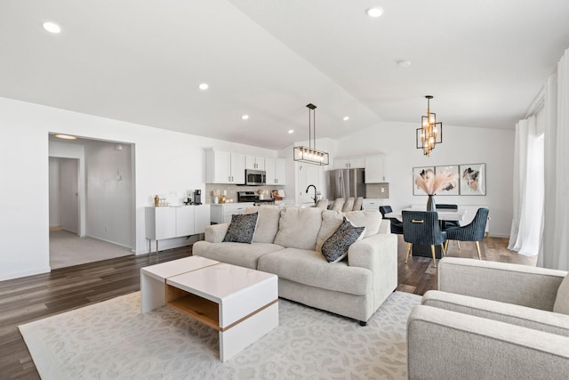 10257 Greenway Cir S, Cottage Grove, MN 55016 - living room featuring lofted ceiling, a chandelier, wood finished floors, recessed lighting, and baseboards