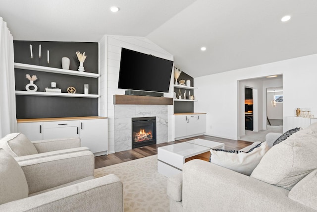10257 Greenway Cir S, Cottage Grove, MN 55016 - living room with a fireplace, wood finished floors, vaulted ceiling, recessed lighting, and built in features