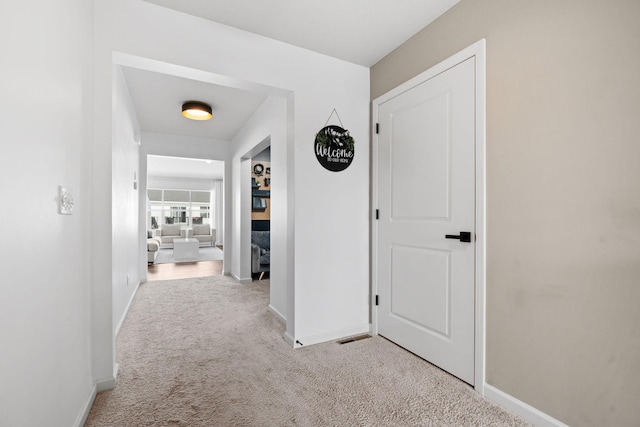 10257 Greenway Cir S, Cottage Grove, MN 55016 - corridor featuring baseboards and carpet flooring