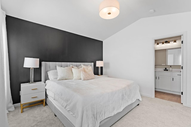 10257 Greenway Cir S, Cottage Grove, MN 55016 - bedroom featuring lofted ceiling, light carpet, ensuite bath, and baseboards