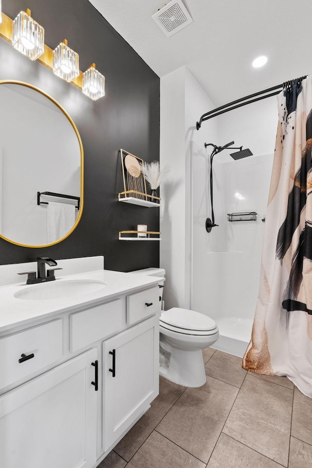 10257 Greenway Cir S, Cottage Grove, MN 55016 - bathroom featuring a shower with curtain, vanity, toilet, and tile patterned floors